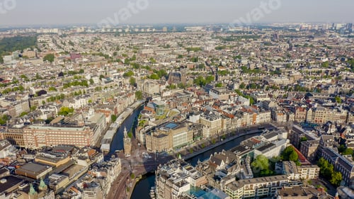 Preview: Amsterdam, Netherlands. Flying Over The City Rooftops. The Historical Part Of The City With Urban