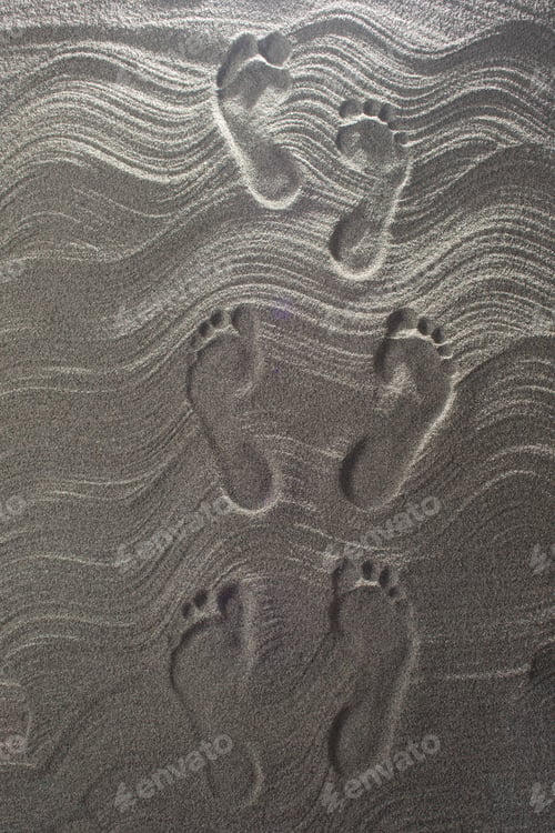 Preview: Set Of Footprints Printed On The Sand In Summer
