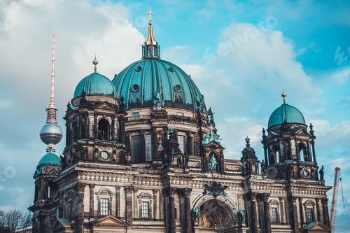 Preview: Historical Christian Berlin Cathedral Church With Multiple Umbrella Type Copper Domes Under Blue