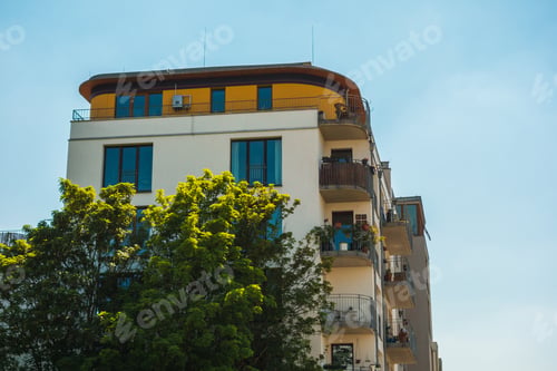 Preview: Big Apartment House With Green Tree In The Foreground
