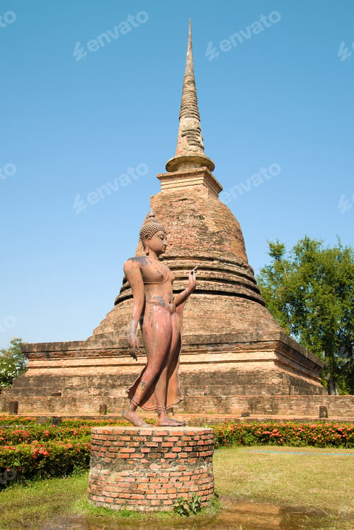 Preview: Sculpture Of A Walking Buddha Against The Backdrop Of A Medieval Stupa. Ruins Of A Buddhist Temple