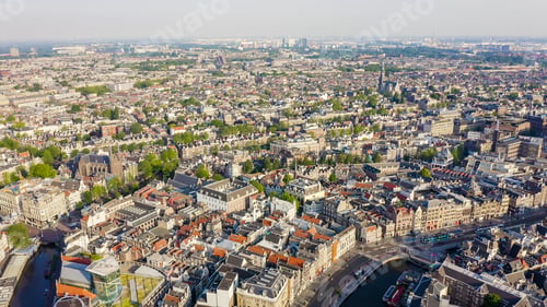 Preview: Amsterdam, Netherlands. Flying Over The City Rooftops. The Historical Part Of The City With Urban