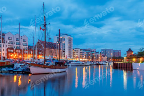 Preview: Multi-Colored Facades And Boat On The Central Waterfront In Gdansk At Night.