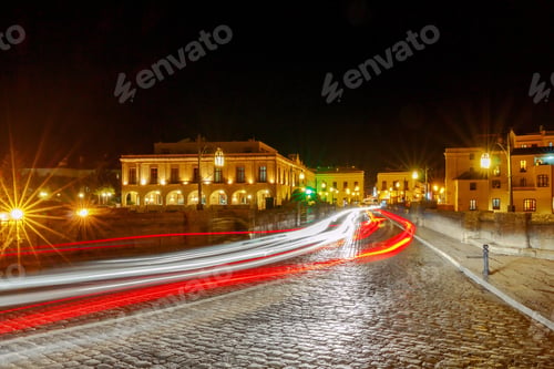 Preview: Traditional Narrow Village Street With Glowing Lanterns In Ronda. Spain. Andalusia.