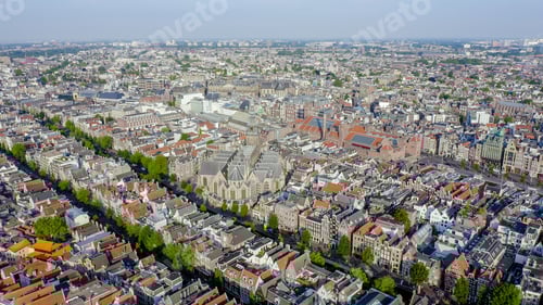 Preview: Amsterdam, Netherlands. Flying Over The City Rooftops Towards Amsterdam Central Station ( Amsterdam