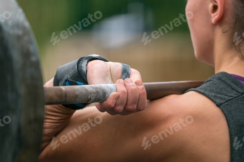 Preview: Woman Holding A Barbell On A Weight Lifting Event