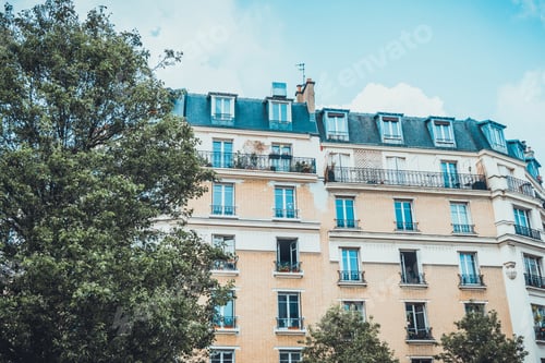 Preview: Low Angle Exterior View On Gabled Windows On Top Floor Of Old Apartment Building