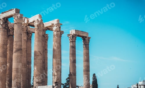 Preview: Pairs Of Ancient Stone Carved Greek Columns Of The Temple Of Zeus Under Blue Sky With Copy Space