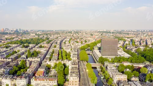 Preview: Amsterdam, Netherlands. Flying Over The City Rooftops. Amstel River, Aerial View