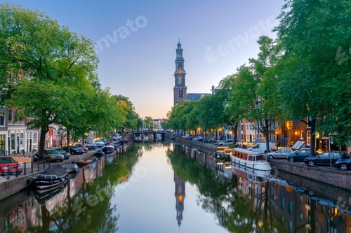 Preview: City Canal With Glowing Lights Early In The Morning. Amsterdam. Netherlands.