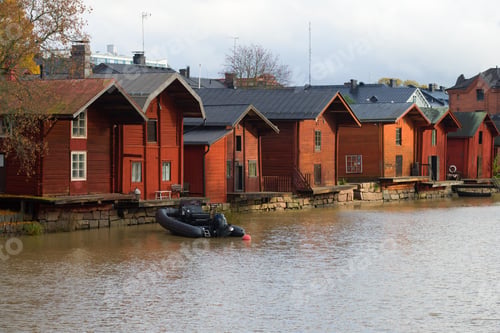 Preview: Old Red Barns On The Shore Of Porvoonjoki River On A Cloudy October Day. Porvoo, Finland