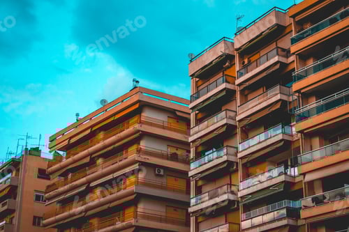 Preview: Orange Old Apartment Houses On A Cloudy Day