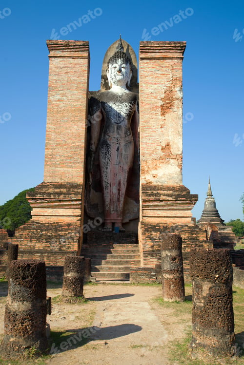 Preview: Ancient Sculpture Of A Standing Buddha On The Ruins Of The Buddhist Temple Of Wat Mahathat On A