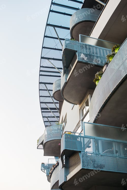 Preview: Modern Curved Facade Of Apartment Building In Warm Colors