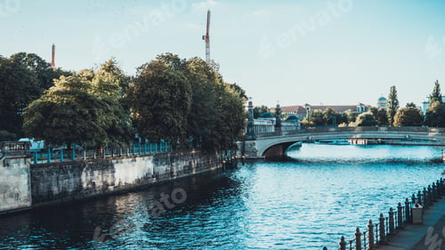 Preview: Wide Open Canal Between Old Viaducts With Railings In Old City Scene With Copy Space To Add Boats
