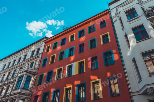 Preview: Colorful Building Between Two White Facaded Houses