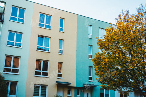 Preview: Yellow And Green Colored Townhouses