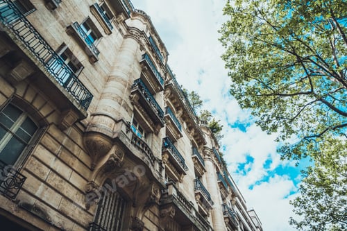 Preview: Extreme Low Angle View On Elegant Apartment Exterior With Detailed Carvings In Stone