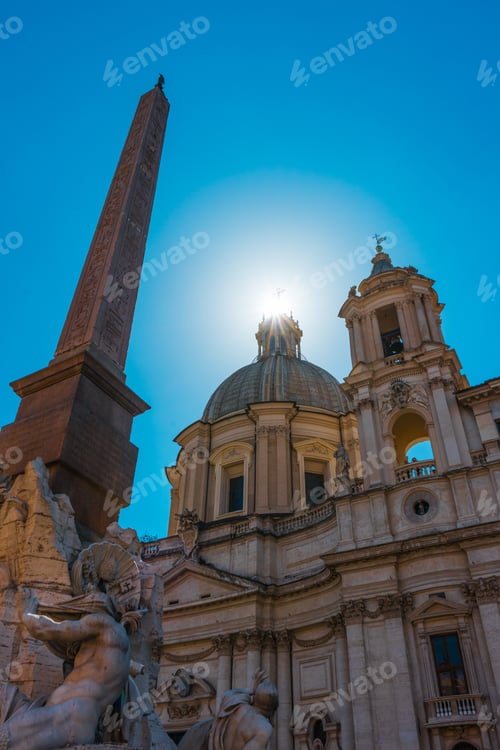 Preview: Egyptian Obelisk , Rome With The Dome Of St Peters Basilica Behind With A Sunburst On Top Viewed