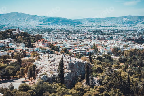Preview: Scenic View Of Pretty European Town Surrounded By Majestic Mountains On A Clear Day