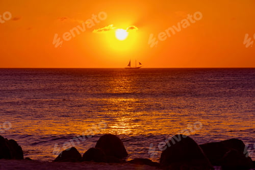 Preview: Bright And Colorful Sunset On The Caribbean Beach In Aruba Island In Winter With People On The