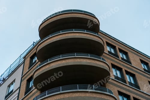 Preview: Round Balconies On Brown Brick Building