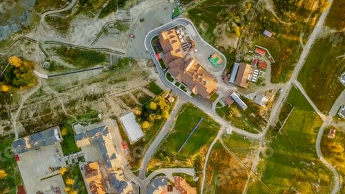 Preview: Rosa Khutor Plateau, Buildings, Slopes And Chair Lifts. Aerial View At Sunset