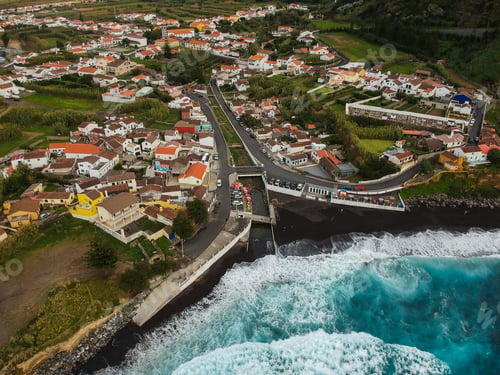 Preview: Aerial Top View Of Sea Waves Hitting A Beach With Black Volcanic Sand With Turquoise Sea Water