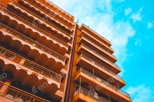 Preview: Low Angle View Of Big Apartment Building With Orange Facade