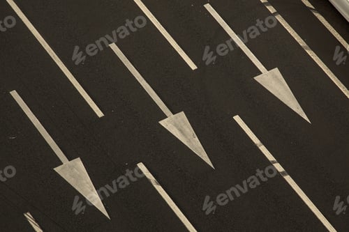 Preview: Arrow Signs As Road Markings On A Street