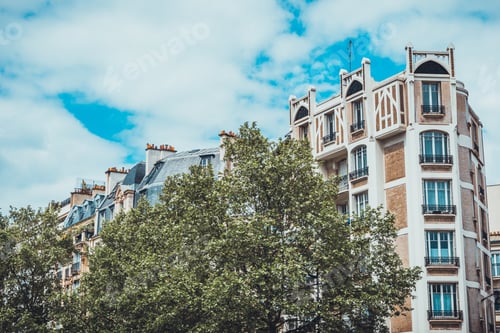 Preview: Trees Covering Part Of Luxury Apartments With Unique Crenelation Over Top Floor Under Sky With