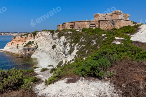 Preview: The Ancient Stone Tower Of St. Lucian And The Fort Over The Bay. Marsaxlokk. Malta.
