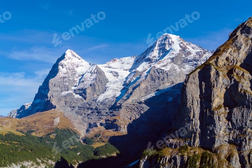 Preview: Eiger, Monk And Jungfrau Mountains In Alps As Seen From Murren Village, Berner Oberland, Switzerland