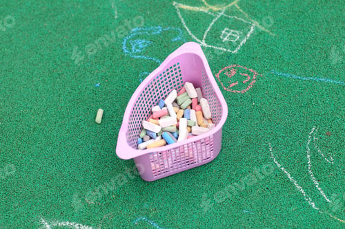 Preview: Colorful Crayons In The Box On The Green Pavement