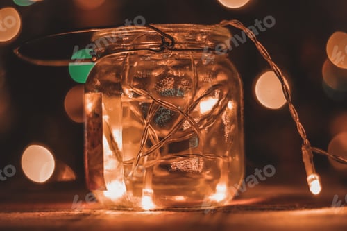 Preview: Transparent Jar With Led Lights Inside And Bokeh Lights In Background. Home Decoration