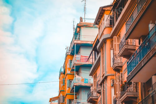 Preview: Orange Mediterranean Buildings At Greece With Blue Sky