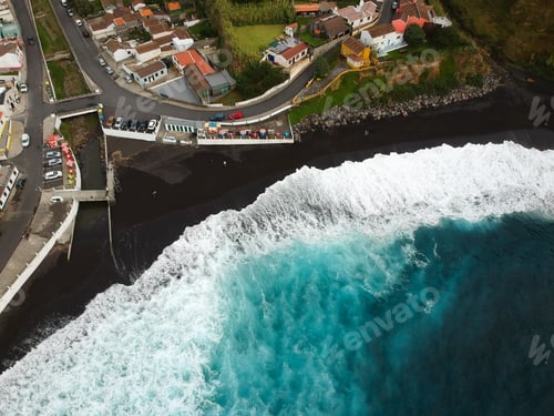 Preview: Aerial Top View Of Sea Waves Hitting A Beach With Black Volcanic Sand With Turquoise Sea Water