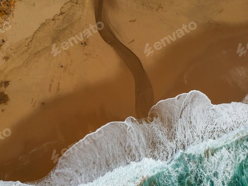 Preview: Aerial View Of Sandy Beach With A Small Brook Running To The Ocean . Drone Photo
