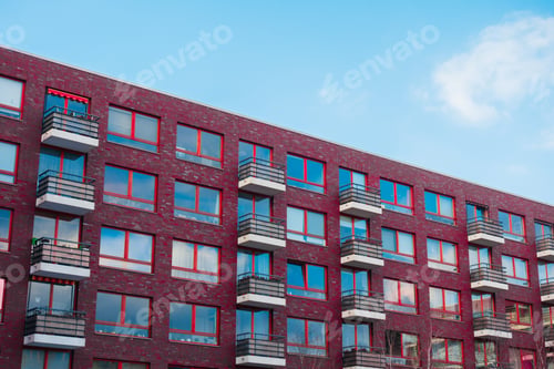 Preview: Brick Apartment Building With White Square Balcony