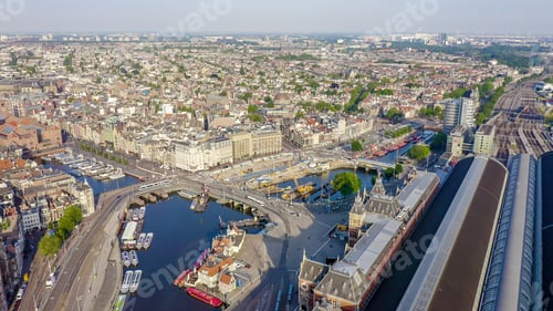 Preview: Amsterdam, Netherlands. Flying Over The City Rooftops. Amsterdam Central Station ( Amsterdam