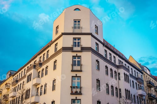 Preview: White Big Corner Building With Blue Sky In The Background