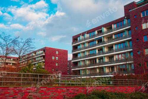 Preview: Big Red Apartment Complex With Green Backyard