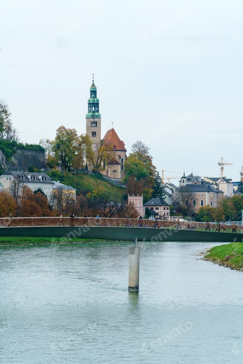 Preview: Makartsteg Bridge Thru Salzach River And Pfarrkirche Mulln (1735), Salzburg, Austria