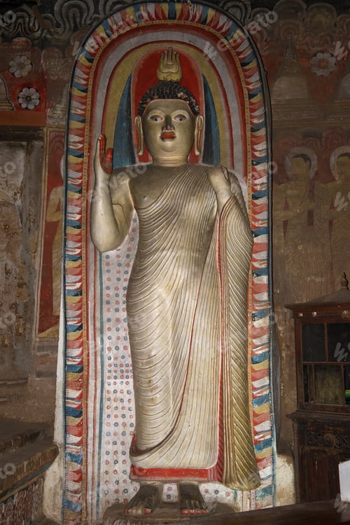 Preview: Ancient Sculpture Of Standing Buddha In The Cave Complex Of The Golden Temple. Dambulla, Sri Lanka