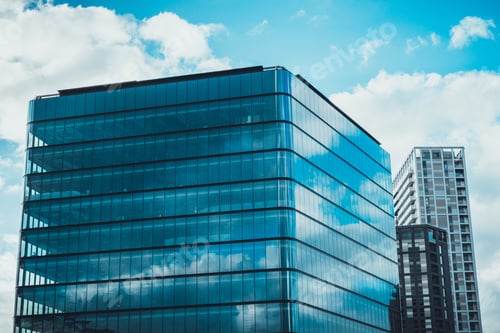 Preview: Modern Office Buildings With Beautiful Cloud Reflections In Glass Facades