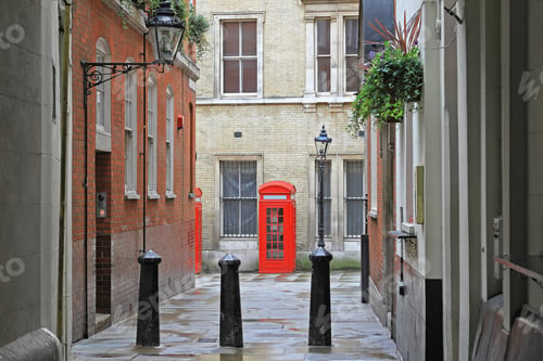 Preview: Traditional British Red Telephone Booth In Small Street