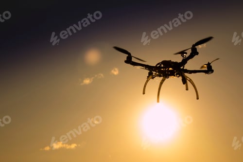 Preview: Photographic Representation Of The Flight Of A Drone At Sunset