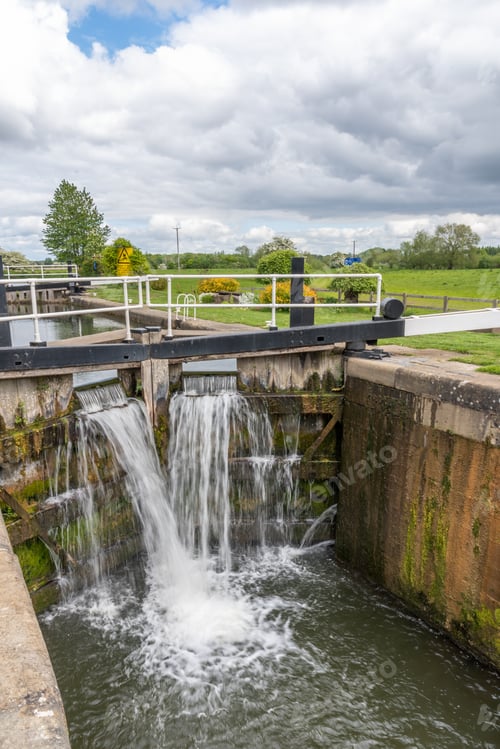 Preview: Water Flowing From Lock Gates On A Canal