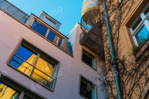 Preview: Old And Modern Building In Low Angle View