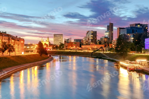 Preview: Night Cityscape Of The Neris River, Church And Skyscrapers In The Center Of Vilnius At Sunset